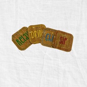 Set of four handmade embroidered coasters